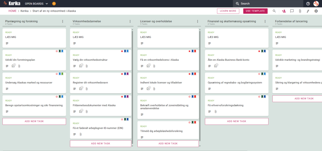 Skærmbillede af Kerikas kanban-tavle, der viser en projekttavle med titlen "At starte en ny virksomhed i Alaska". Tavlen indeholder et venstre-til-højre-workflow med kolonner til planlægning og research, virksomhedsdannelse, licensering og overholdelse, finansiel og skattemæssig opsætning og opstartsforberedelse, der inkluderer specifikke opgavekort, såsom "Udvikl din forretningsplan" og "Få din Alaska-forretningslicens".